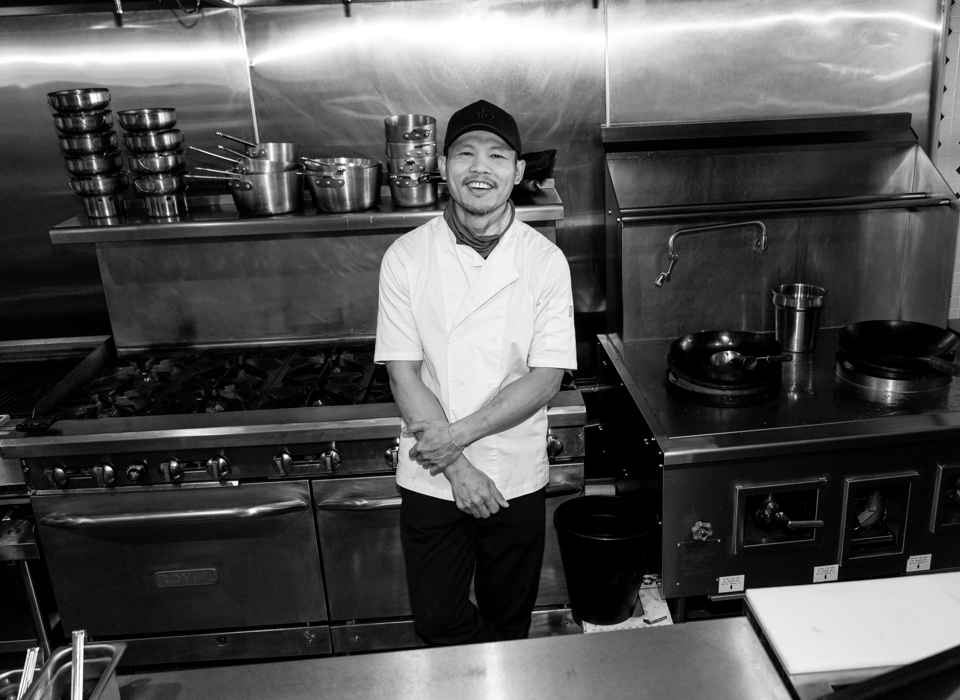 Black and white kitchen portrait of Chef Ono