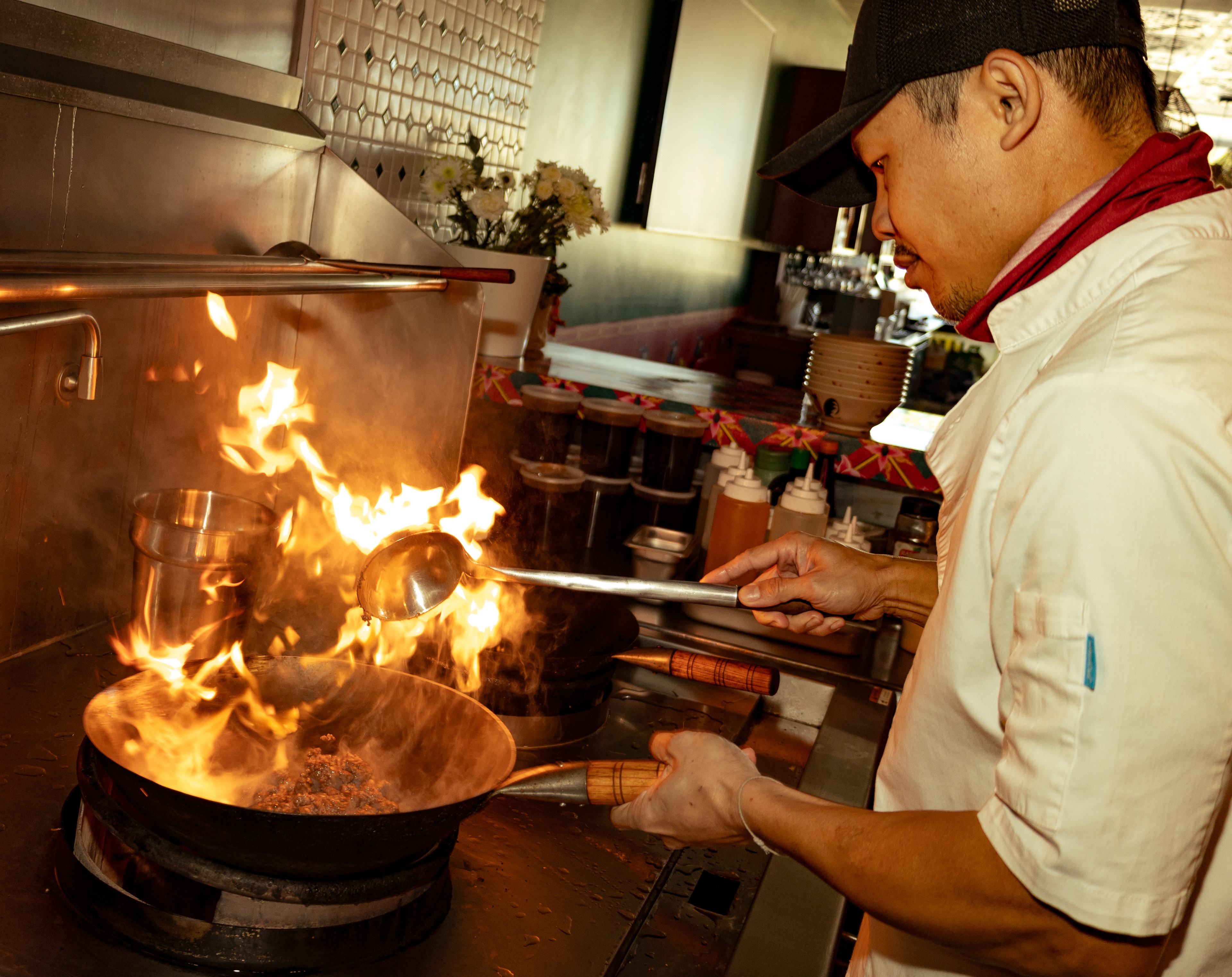 Chef Ono cooking over high flame wok